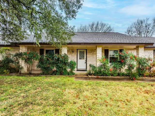 a house view with a garden space