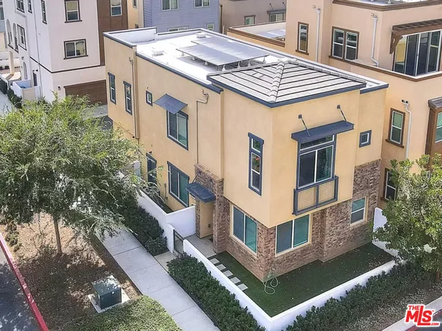 a view of a building with a yard