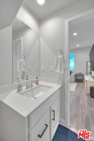 a bathroom with a sink and a mirror