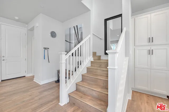 a view of entryway with wooden floor