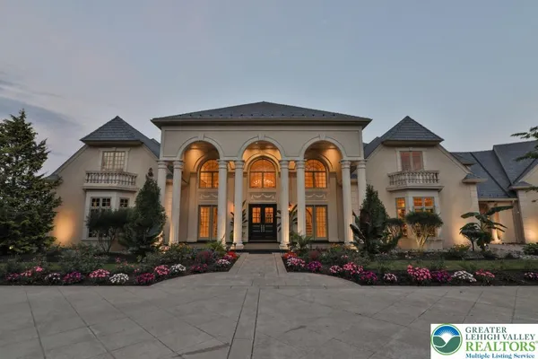 a kitchen with stainless steel appliances granite countertop a sink counter space cabinets and living room view