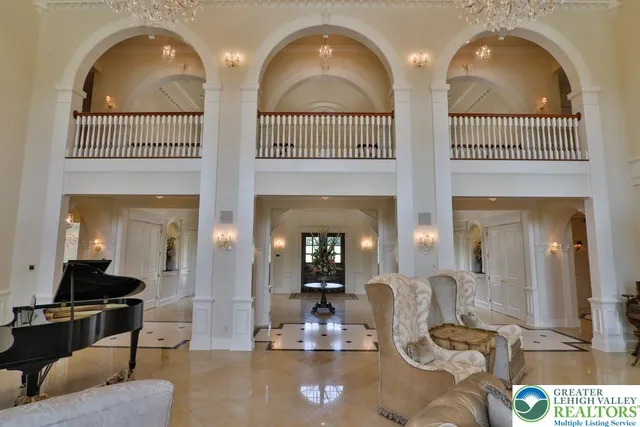 a bathroom with a granite countertop toilet sink and mirror