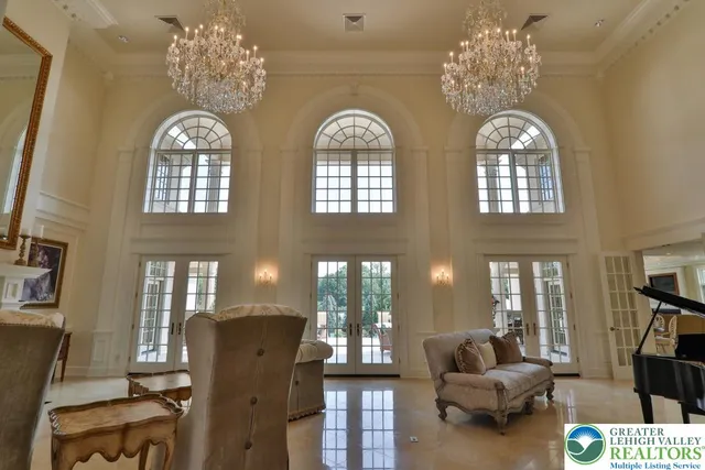 a spacious bedroom with bed and a fireplace