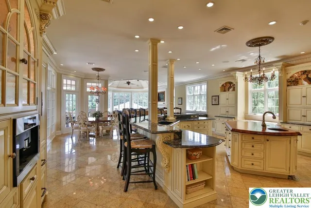 a spacious bedroom with a bed and wooden floor