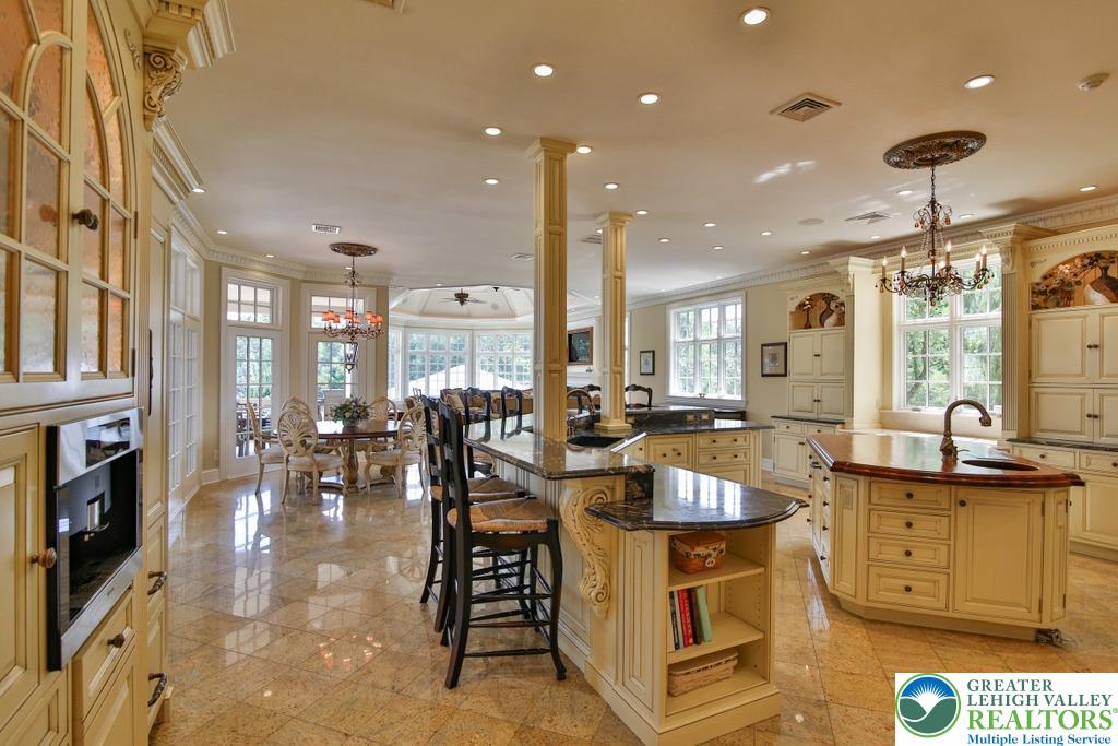 5044 Vera Cruz Road Center Valley, PA 18034 - Photo 22 of 100 an open kitchen with granite countertop a stove and white cabinets