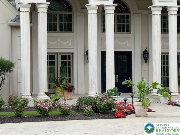 a front view of a house with garden