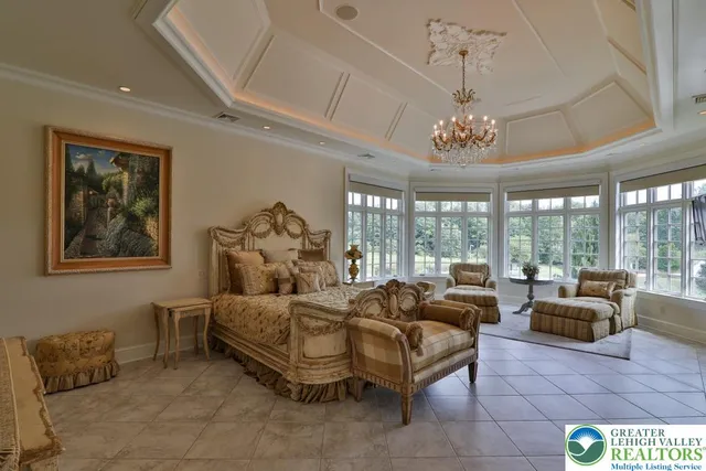 a view of a patio with a table chairs and a floor to ceiling window