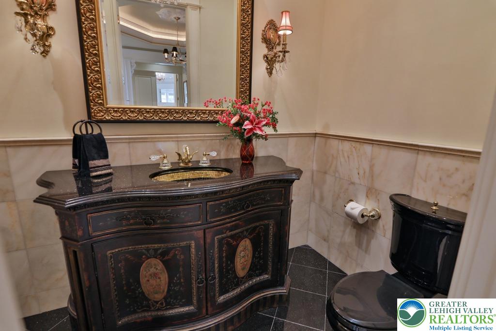 5044 Vera Cruz Road Center Valley, PA 18034 - Photo 35 of 100 a bathroom with a sink and a mirror