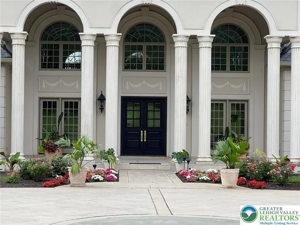 a front view of a house having yard