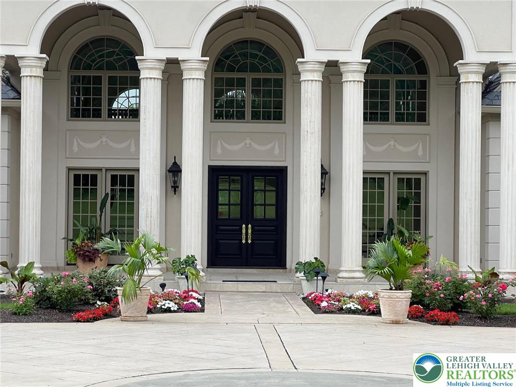 5044 Vera Cruz Road Center Valley, PA 18034 - Photo 5 of 100 a front view of a house with a garden