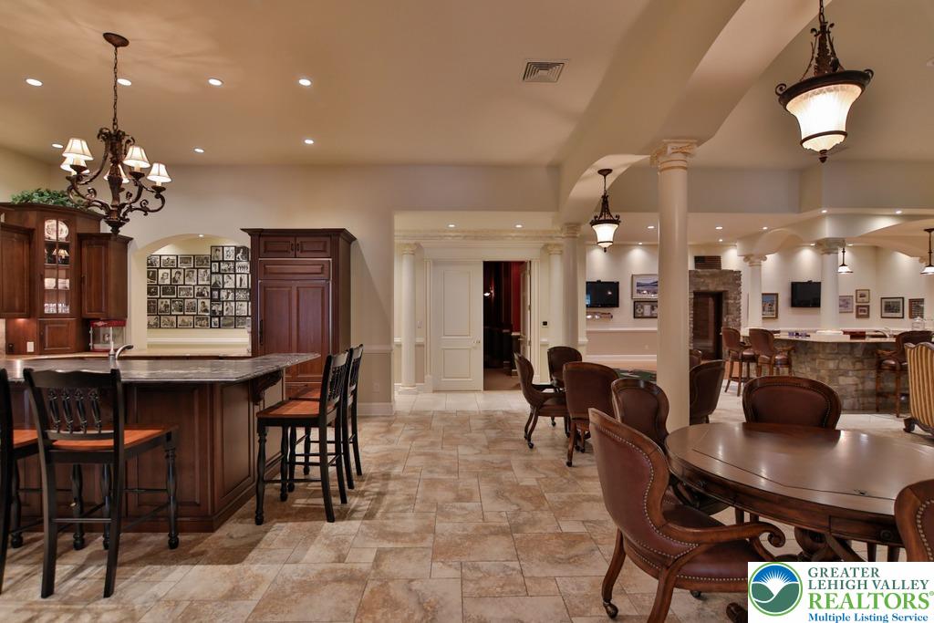 5044 Vera Cruz Road Center Valley, PA 18034 - Photo 58 of 100 a dining room with furniture a chandelier and kitchen view