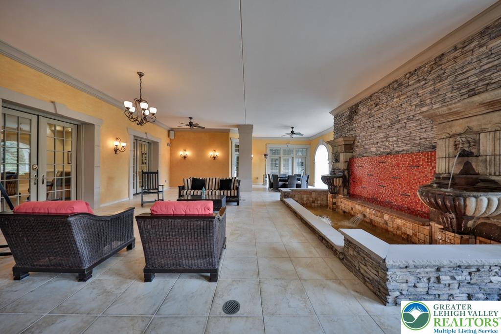 5044 Vera Cruz Road Center Valley, PA 18034 - Photo 68 of 100 a living room with furniture and a chandelier