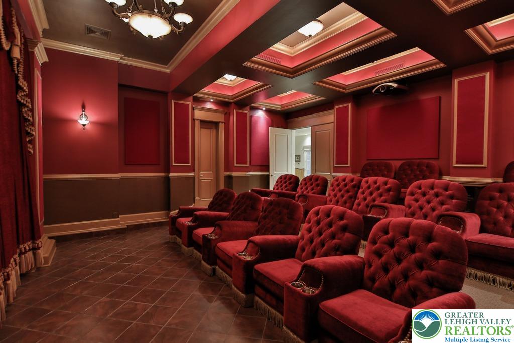 5044 Vera Cruz Road Center Valley, PA 18034 - Photo 69 of 100 a media room with lots of chairs and a projector