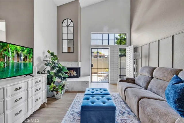 a living room with furniture and flowers