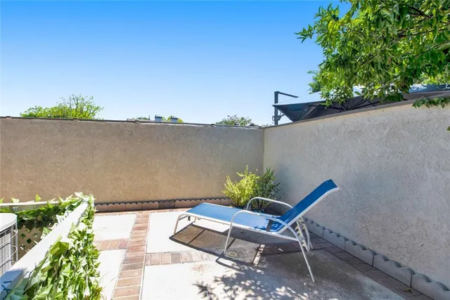 a view of a chairs and table in a terrace