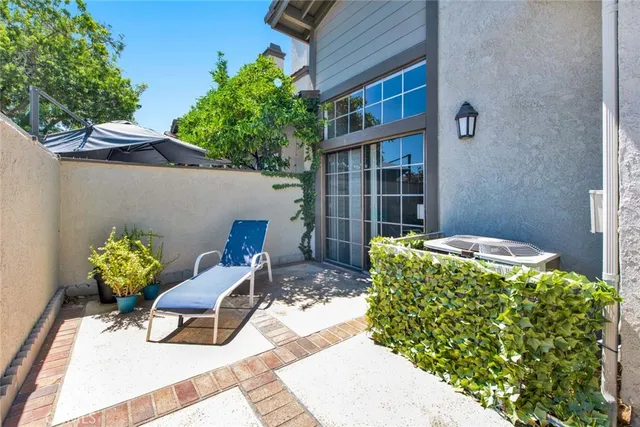 a view of a livingroom with furniture and a window