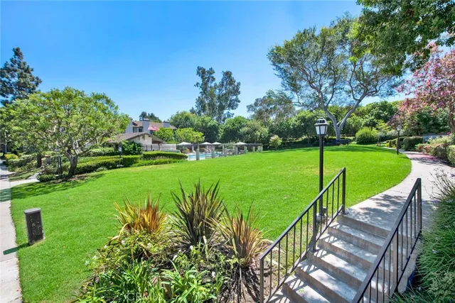 a green field with lots of trees in it