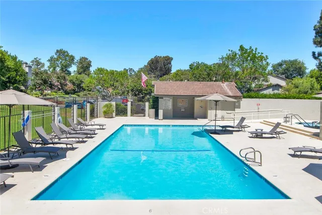a view of a patio with chairs and a table