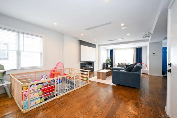 a dining room filled counter top space with furniture and a wooden floor