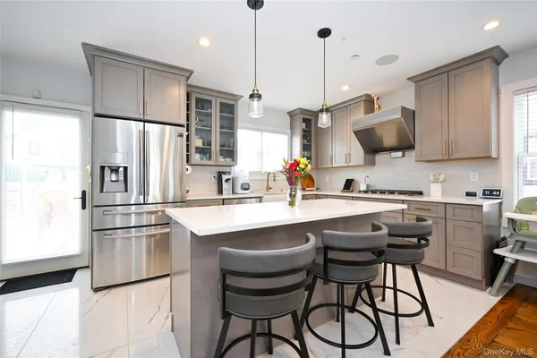 a kitchen with a sink stove and microwave