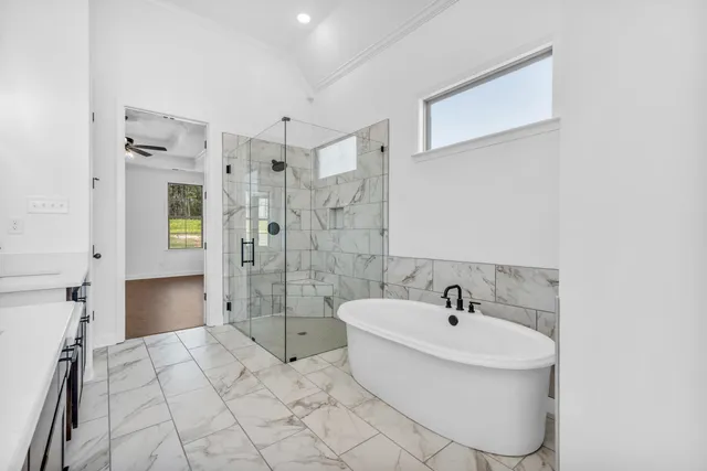 a bathroom with a toilet and shower