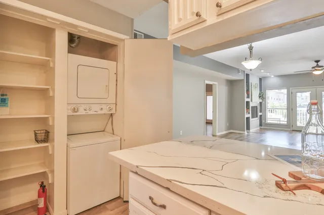 a view of a patio with table and chairs and potted plants
