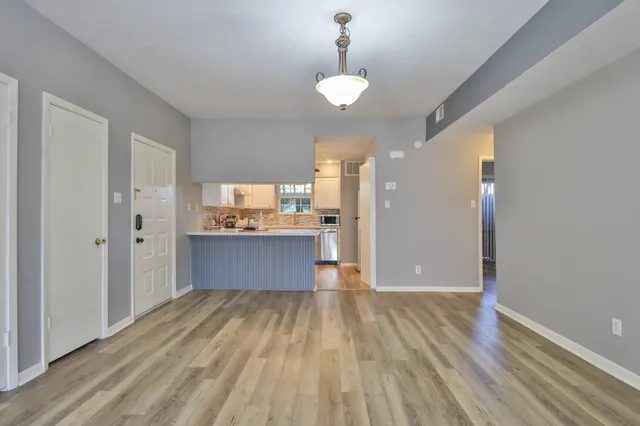 an empty room with a empty space and a ceiling fan