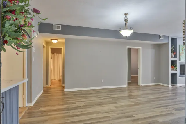 a view of a swimming pool and a yard