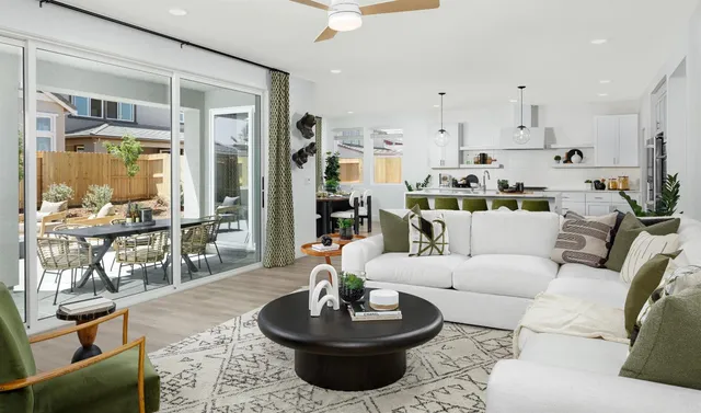 a view of a dining room with furniture and chandelier