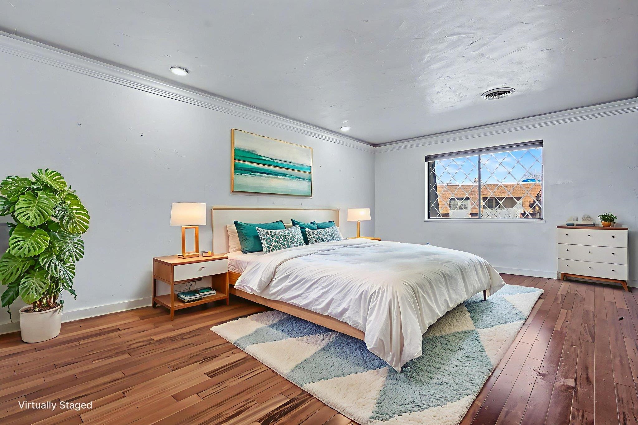 2700 G Road, Unit 12F Grand Junction, CO 81506 - Photo 13 of 24 a spacious bedroom with a bed table and a window