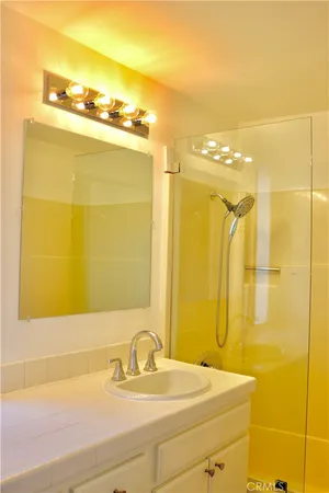 a bathroom with a sink and a mirror