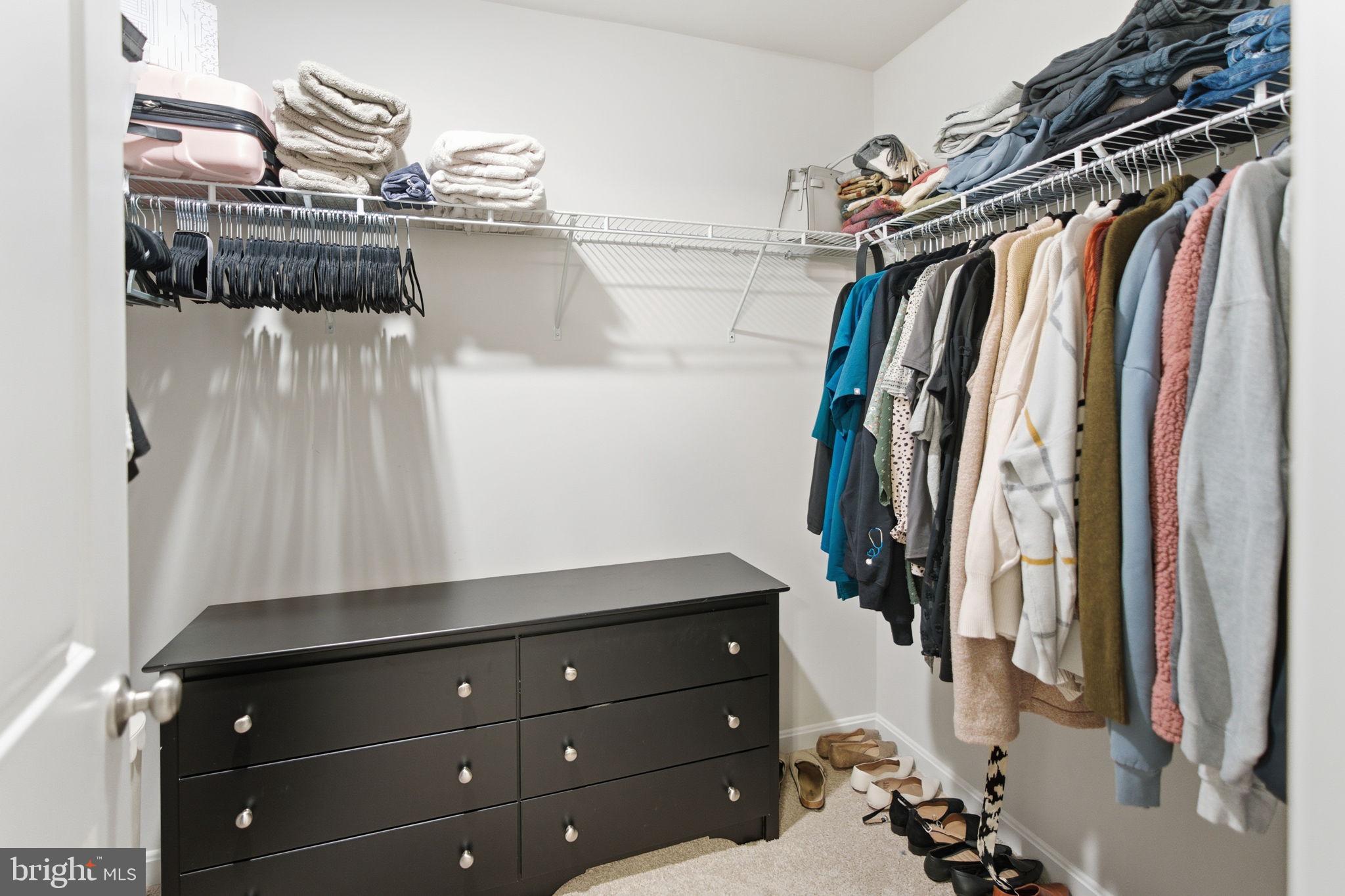 715 Courier Lane Frederick, MD 21701 - Photo 21 of 26 a view of walk in closet with clothes and shoes
