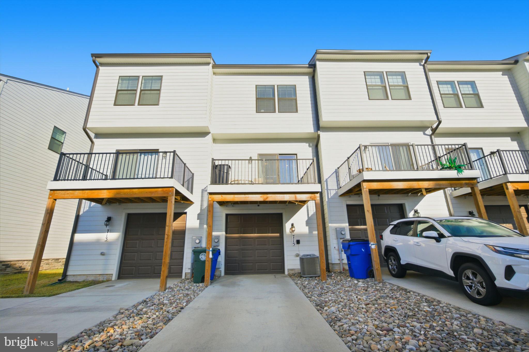 715 Courier Lane Frederick, MD 21701 - Photo 7 of 26 a view of a car park in front of house