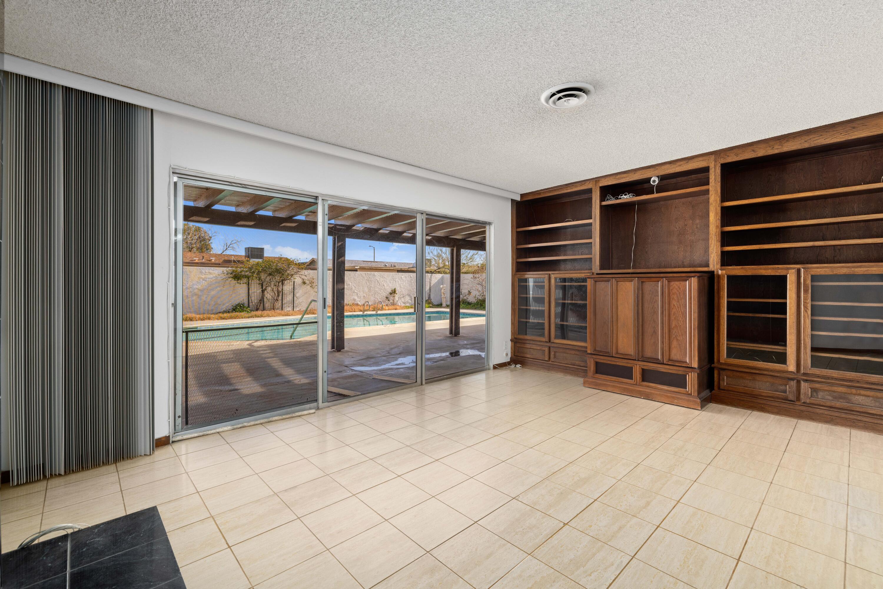 37800 Rudall Avenue Palmdale, CA 93550 - Photo 14 of 35 a view of an empty room with wooden floor and a window