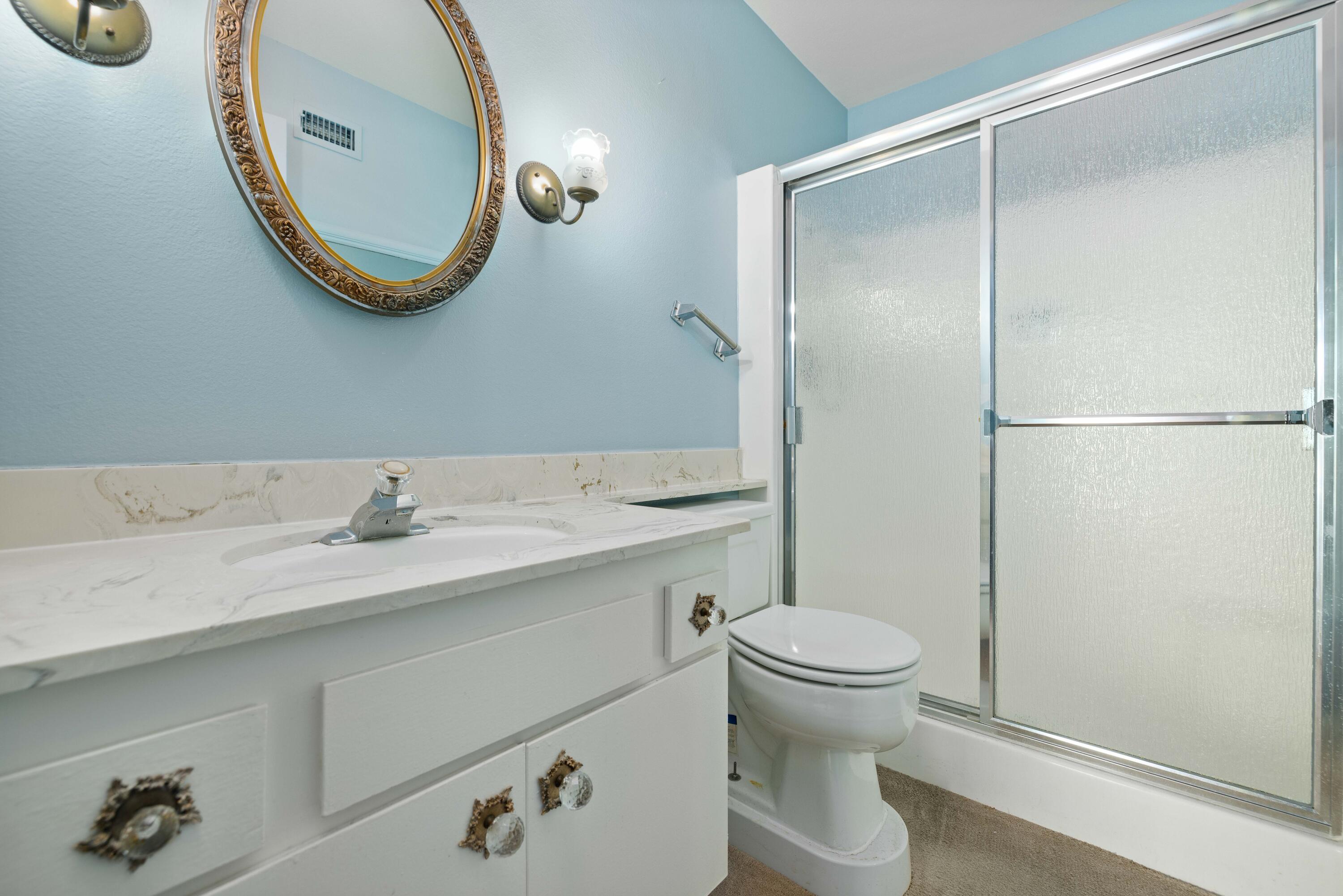 37800 Rudall Avenue Palmdale, CA 93550 - Photo 25 of 35 a bathroom with a sink a toilet and a mirror