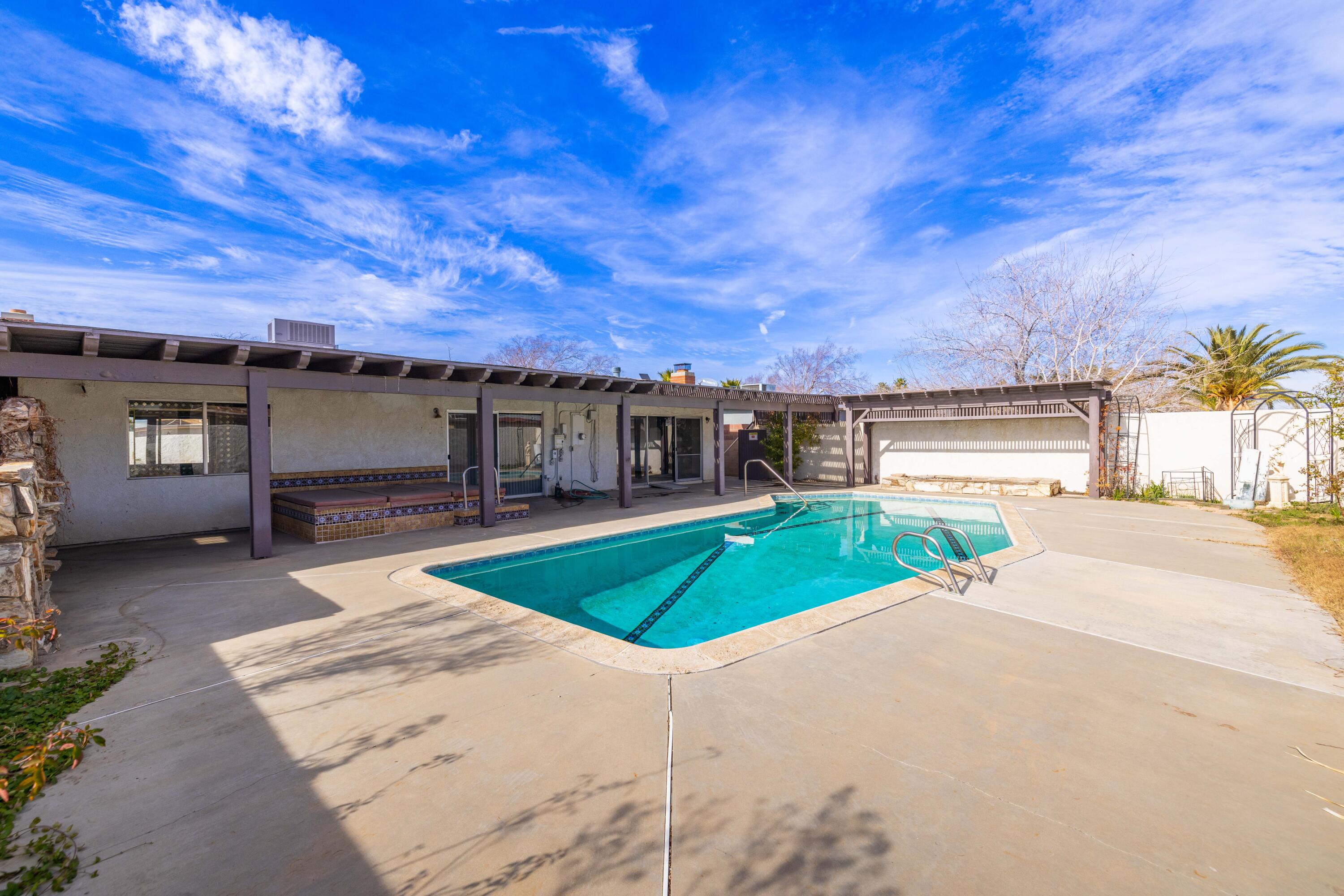 37800 Rudall Avenue Palmdale, CA 93550 - Photo 30 of 35 a front view of a house with a yard and garage
