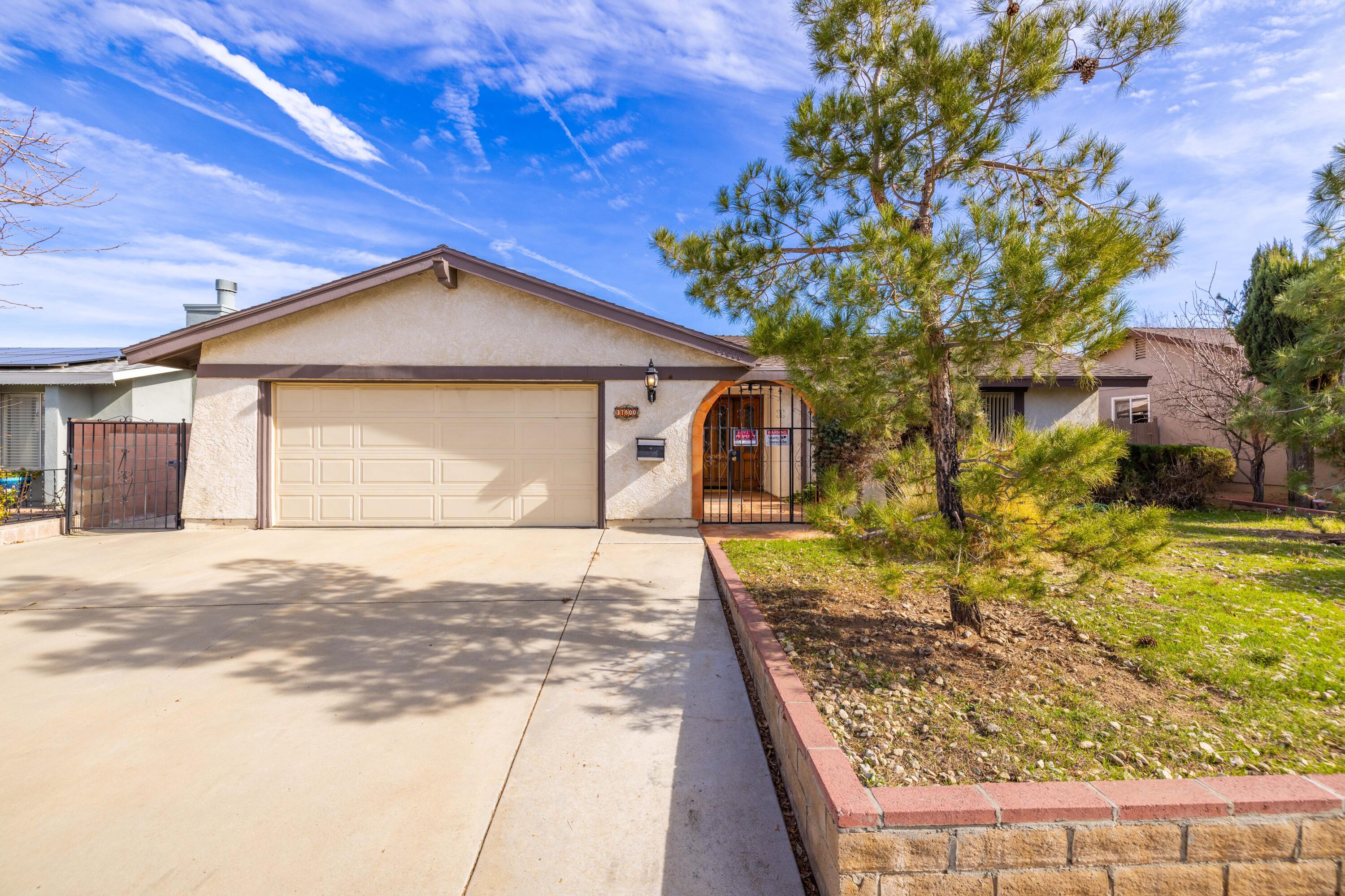 37800 Rudall Avenue Palmdale, CA 93550 - Photo 3 of 35 a front view of a house with garden