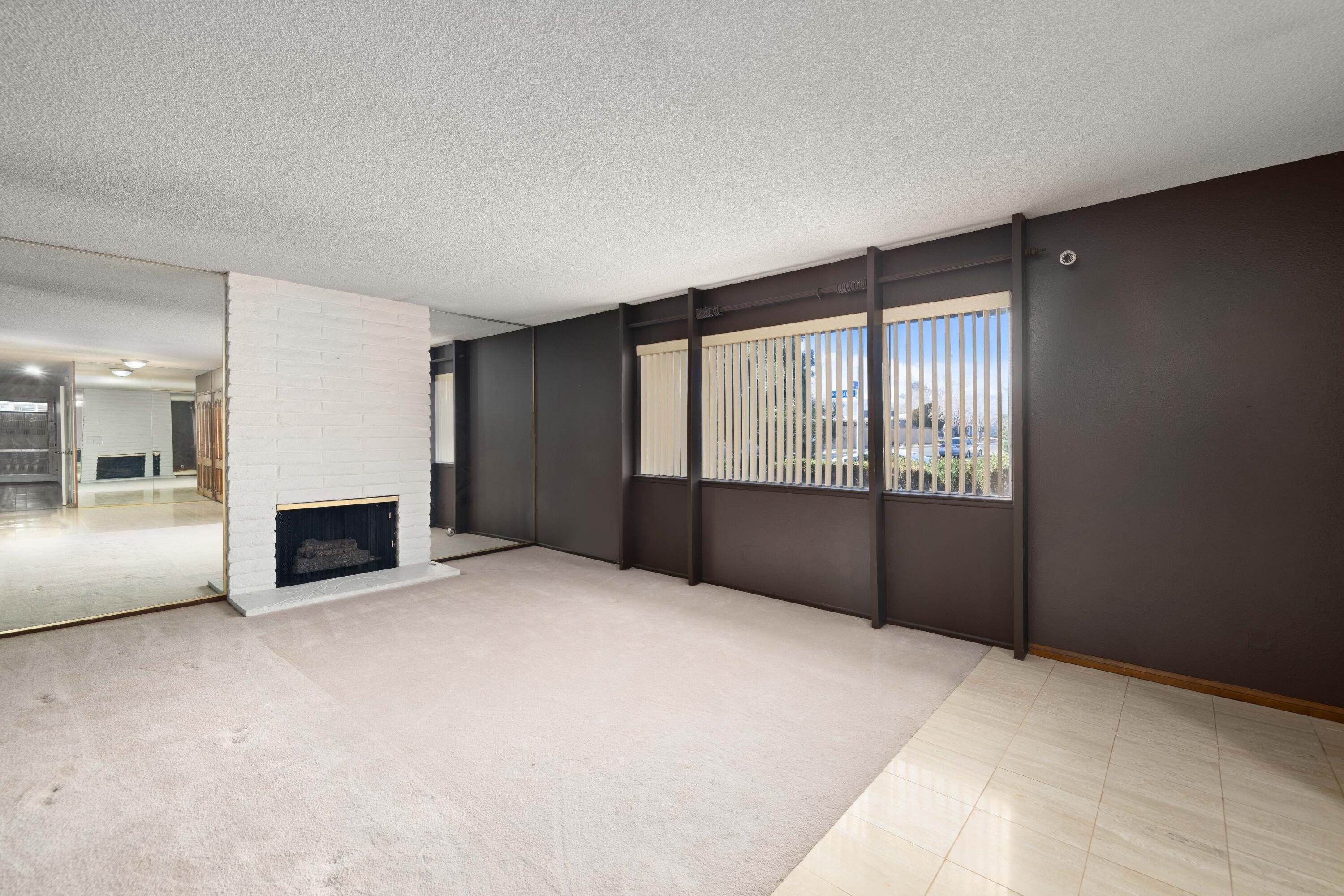 37800 Rudall Avenue Palmdale, CA 93550 - Photo 5 of 35 a view of an empty room with a window and fire place