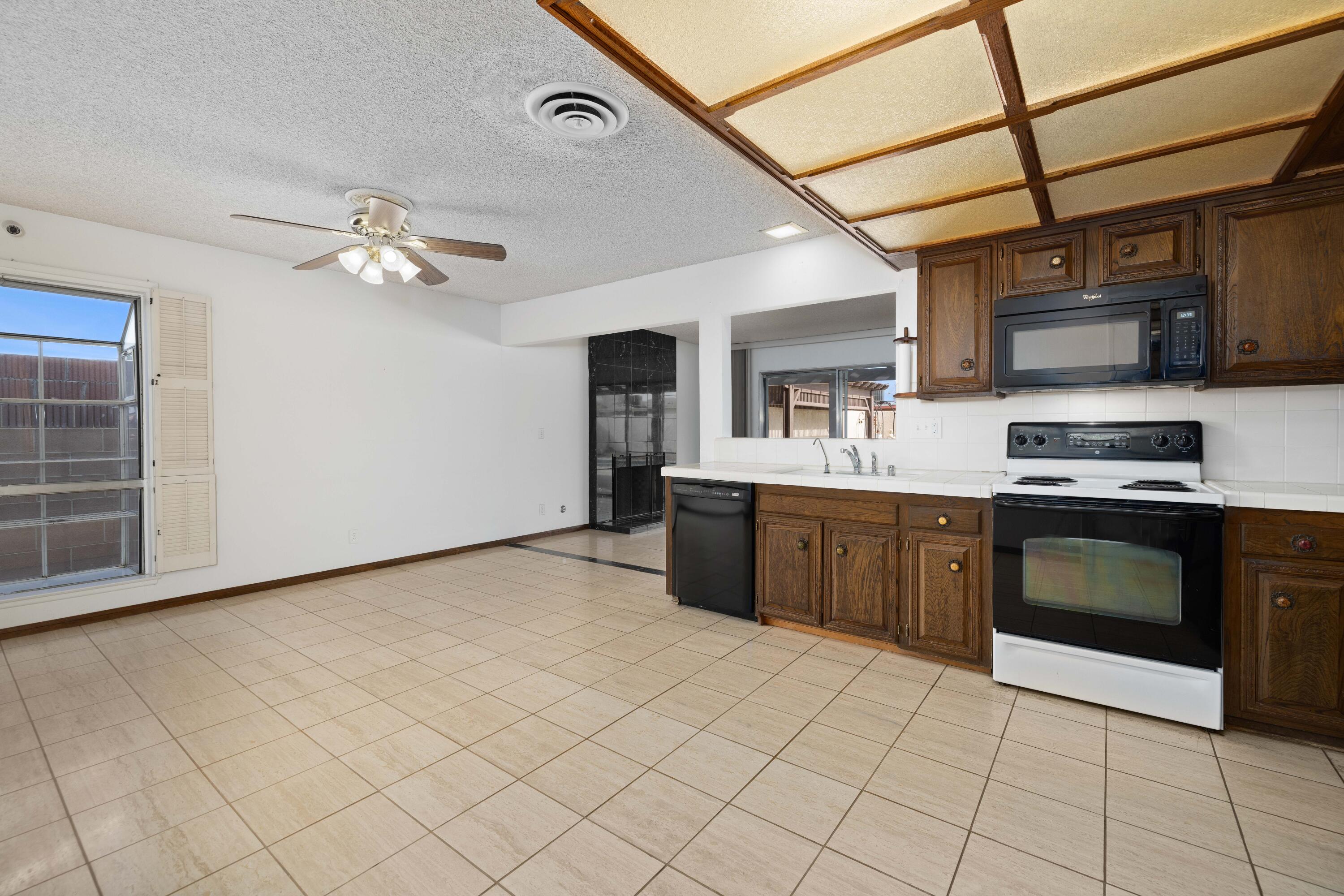 37800 Rudall Avenue Palmdale, CA 93550 - Photo 10 of 35 a kitchen with stainless steel appliances granite countertop a sink a stove top oven and cabinets