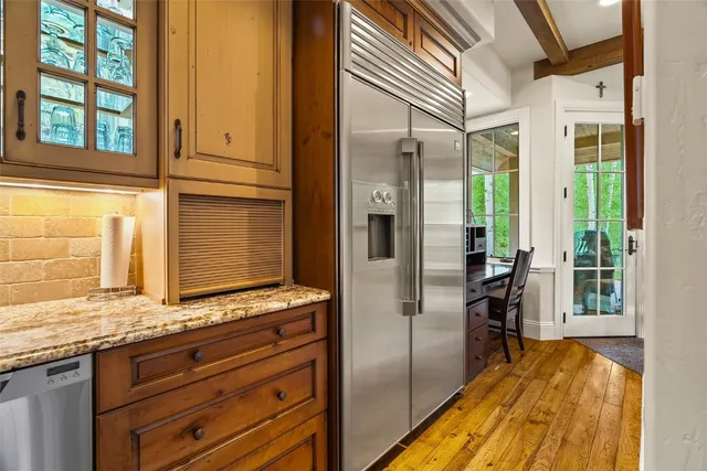 a view of a kitchen from the hallway