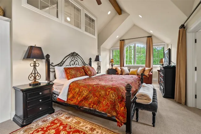 a bed room with a bed and a chair