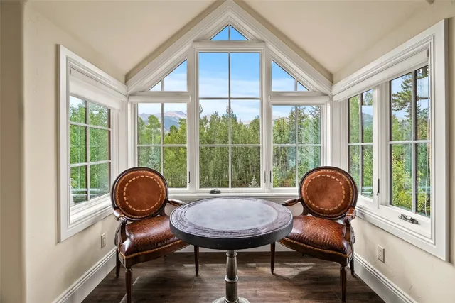 a bedroom with a bed and a lamp on dresser