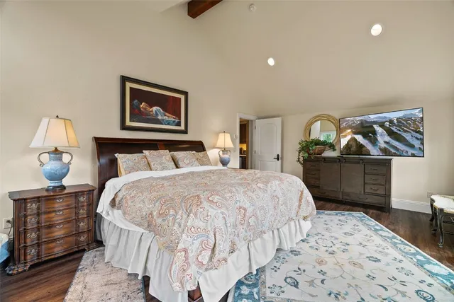 a bathroom with a double vanity sink a toilet and a window