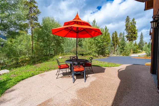 a view of house with backyard outdoor seating and green space