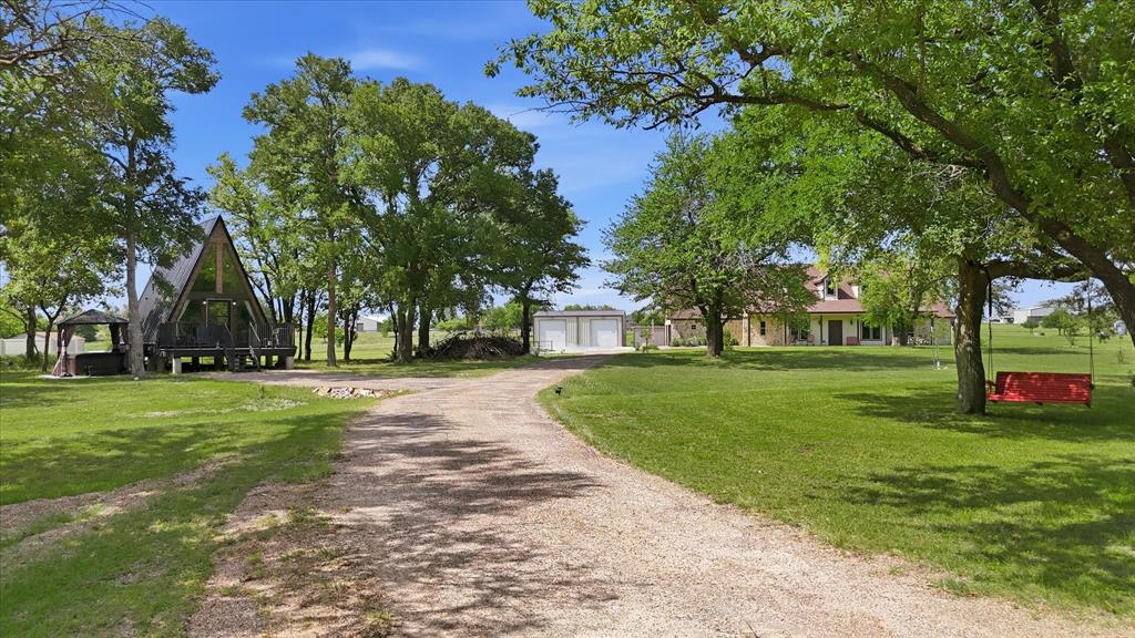 4920 Peden Road Fort Worth, TX 76179 - Photo 2 of 40 Long Driveway Leading to Tiny Cabin and Primary Home.