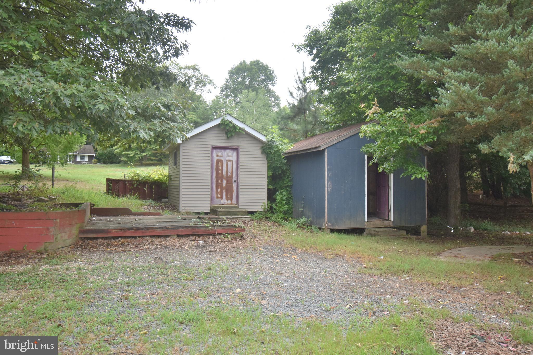 3838 Sixes Road Prince Frederick, MD 20678 - Photo 11 of 12 a view of a house with a yard and large tree