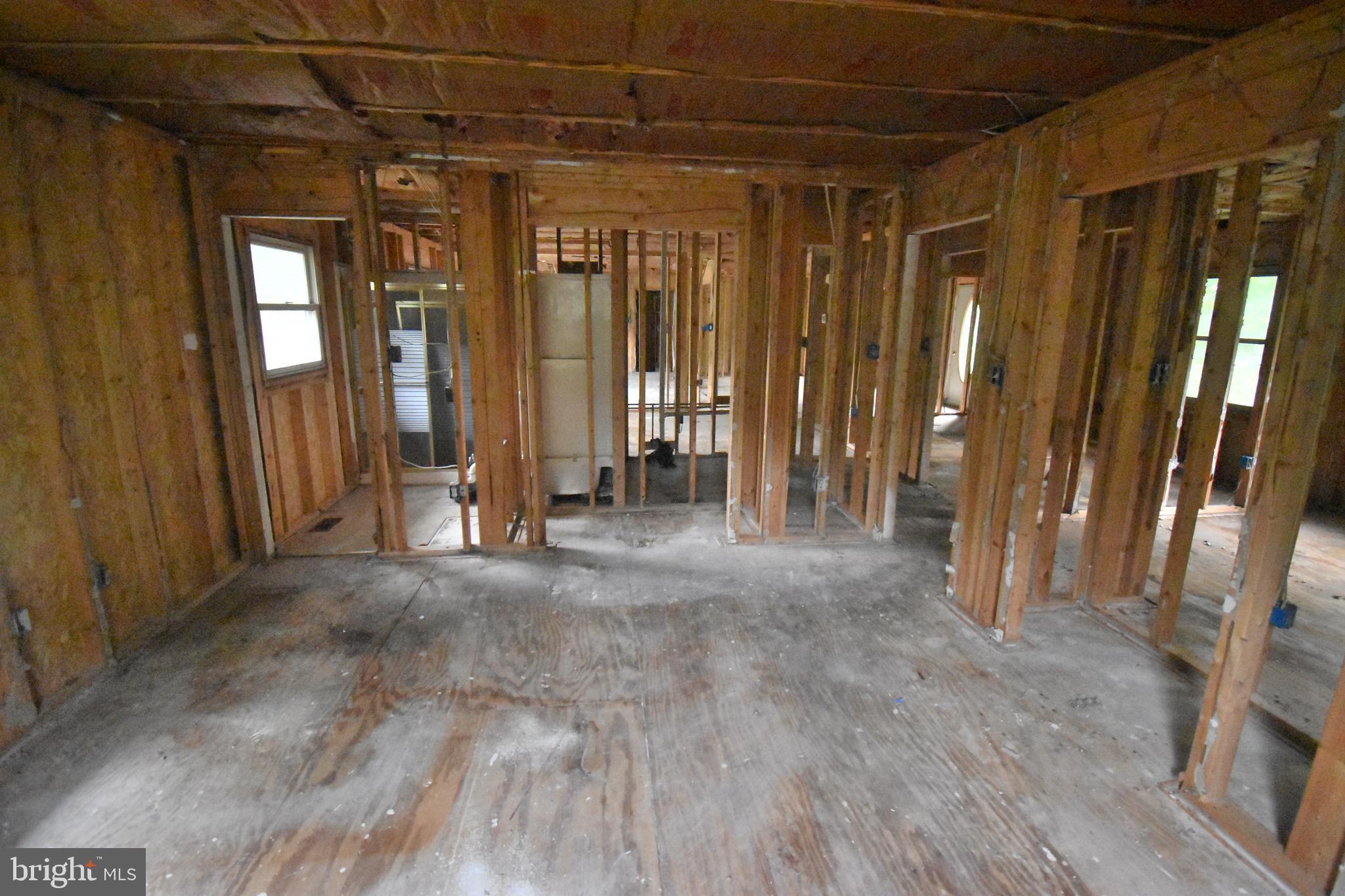 3838 Sixes Road Prince Frederick, MD 20678 - Photo 5 of 12 a view of an empty room with glass door