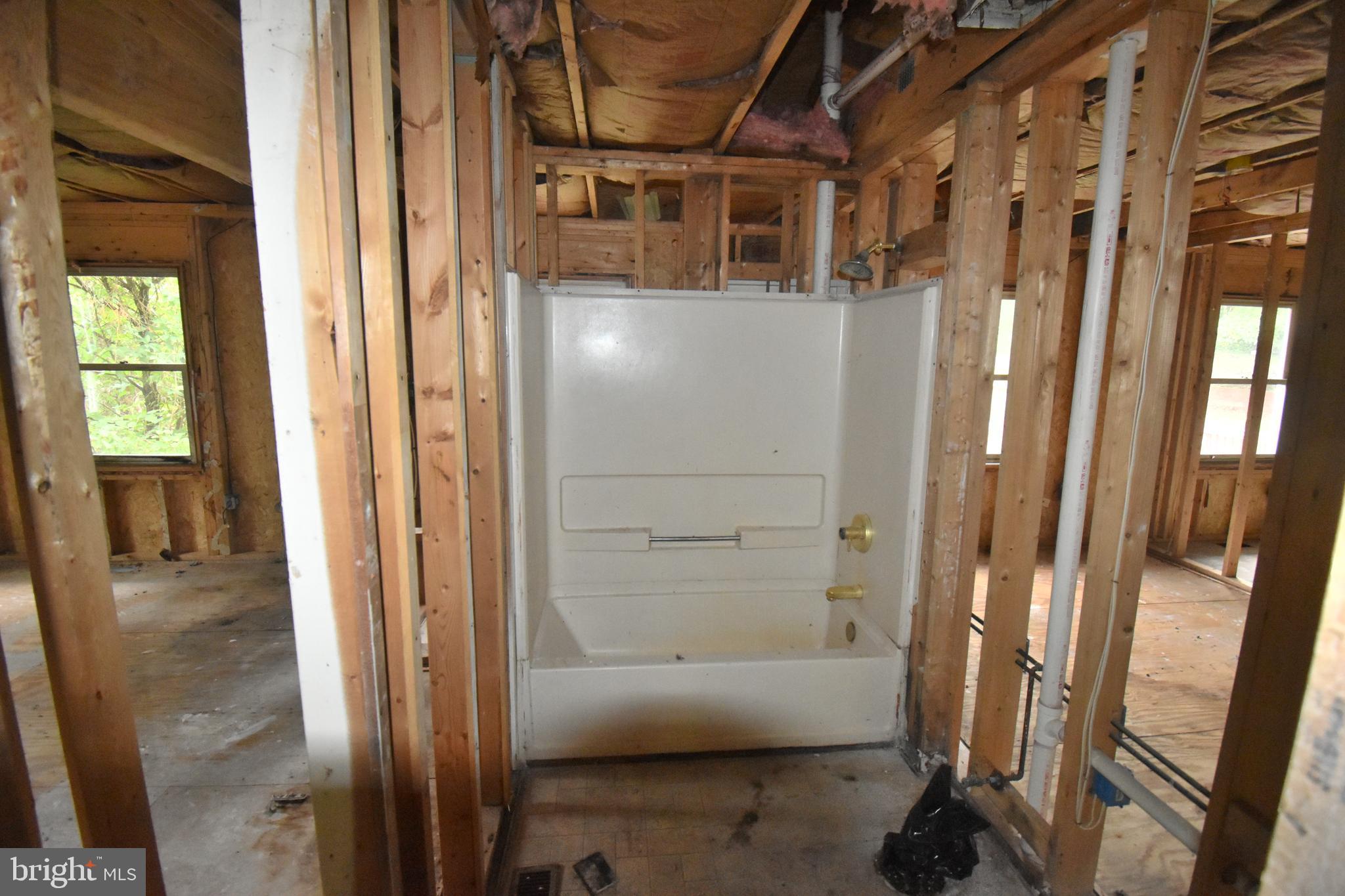 3838 Sixes Road Prince Frederick, MD 20678 - Photo 6 of 12 a bathroom with a tub and a shower