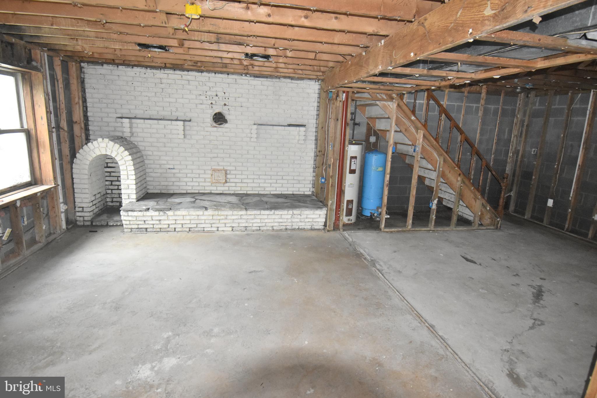3838 Sixes Road Prince Frederick, MD 20678 - Photo 8 of 12 a view of an empty room with stairs