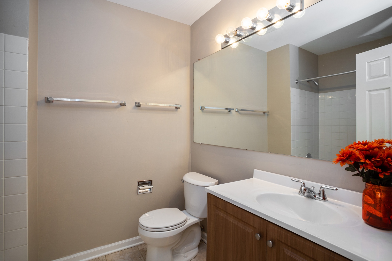 153 Inverness Court Elk Grove Village, IL 60007 - Photo 12 of 16 a bathroom with a sink toilet and vanity